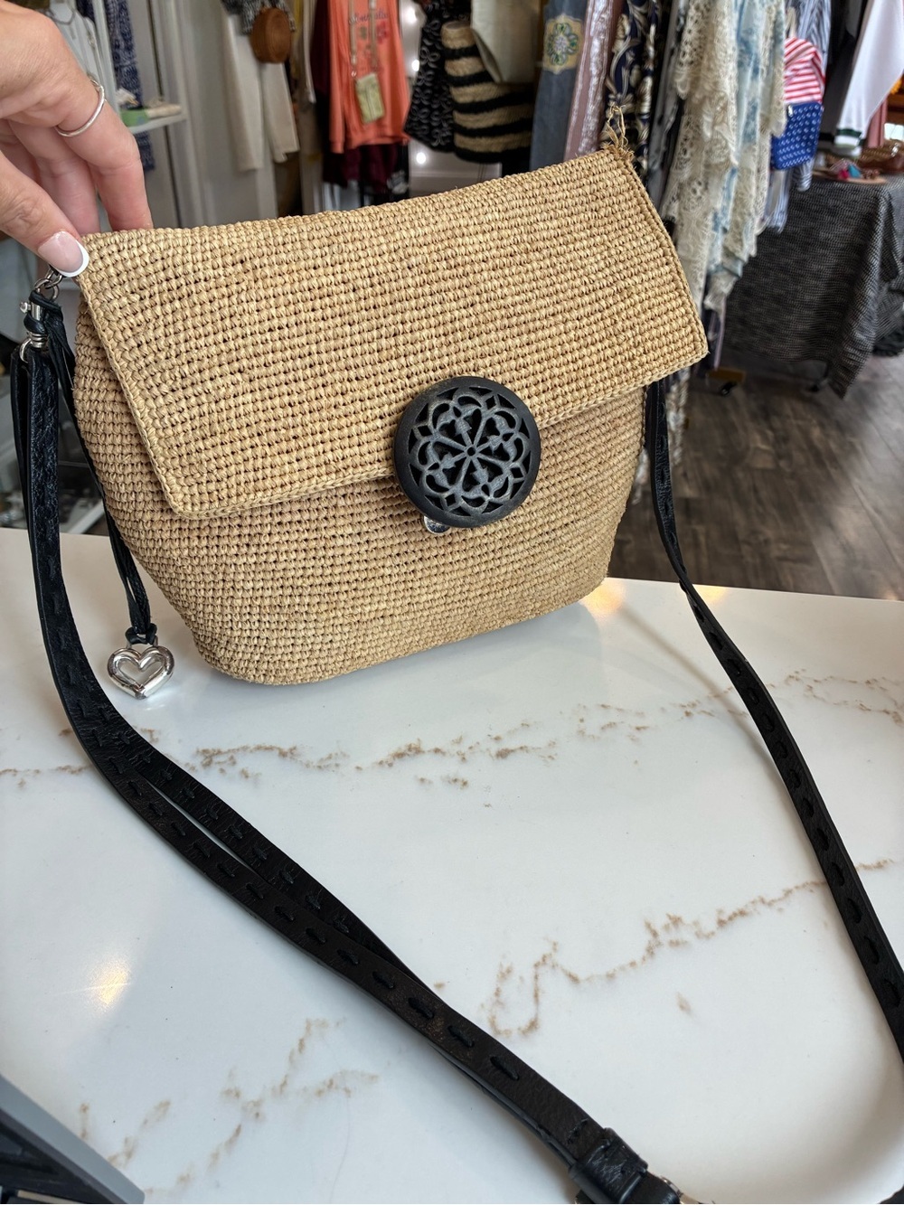Brighton Woven Straw Crossbody Bag with Black Strap and Decorative Medallion
